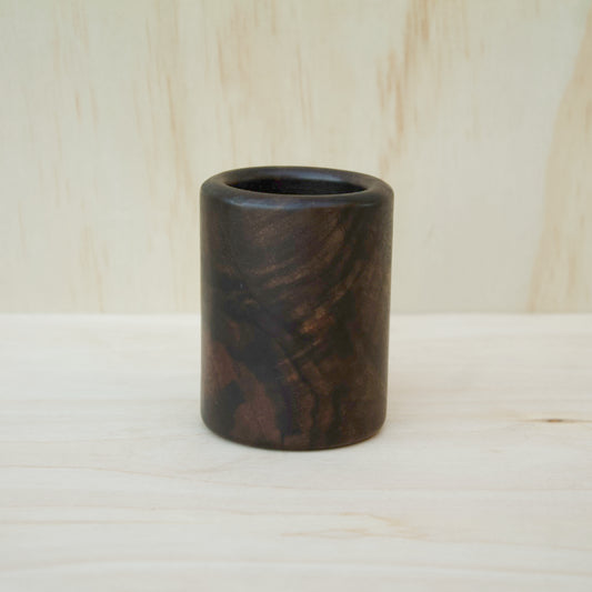 dark wooden cup with bold, intricate grain lines and deep tones