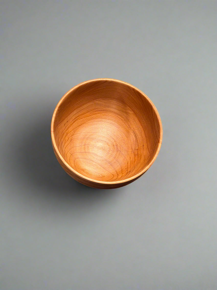 Wooden bowl on a gray background