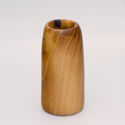 Stunning tall mulberry wood shot glass against white background