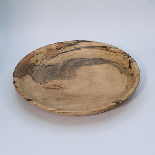 Wooden bowl with marbled pattern on a white background