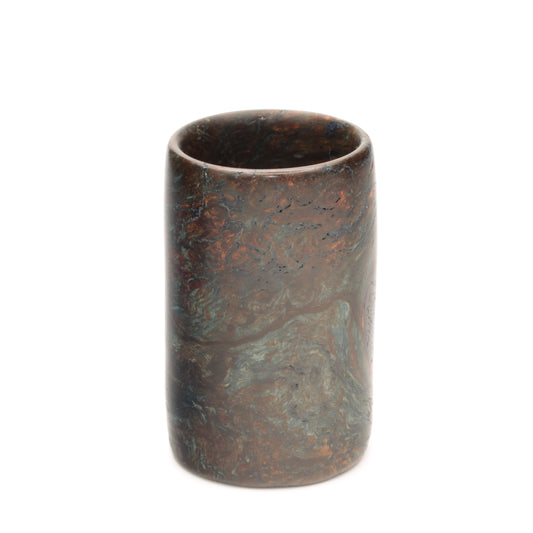 A wood shot glass that looks like a famous painting on white background