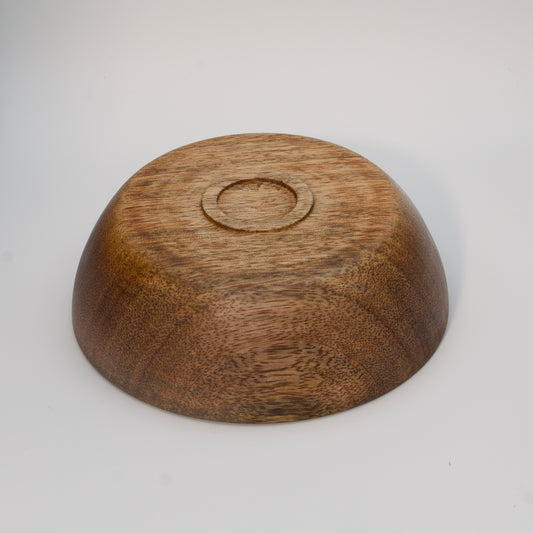 Mango wood bowl against white background