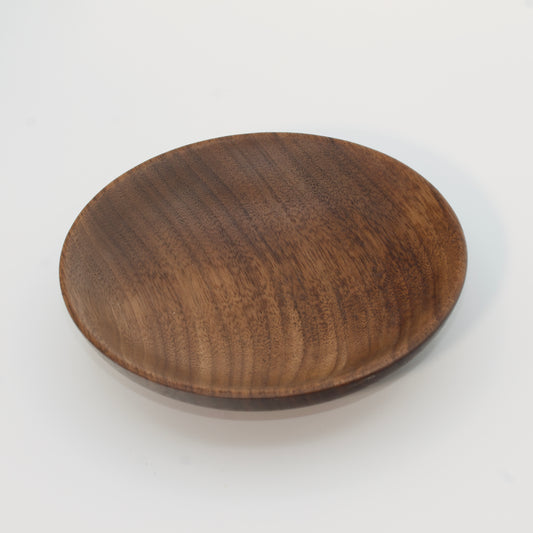 Wooden plate on a white background