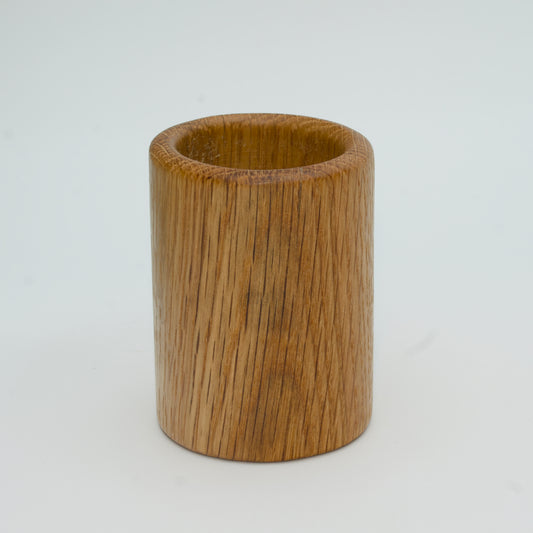 Oak shot glass against white background