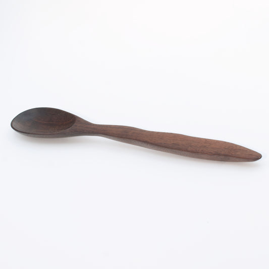 Wooden spoon on a white background