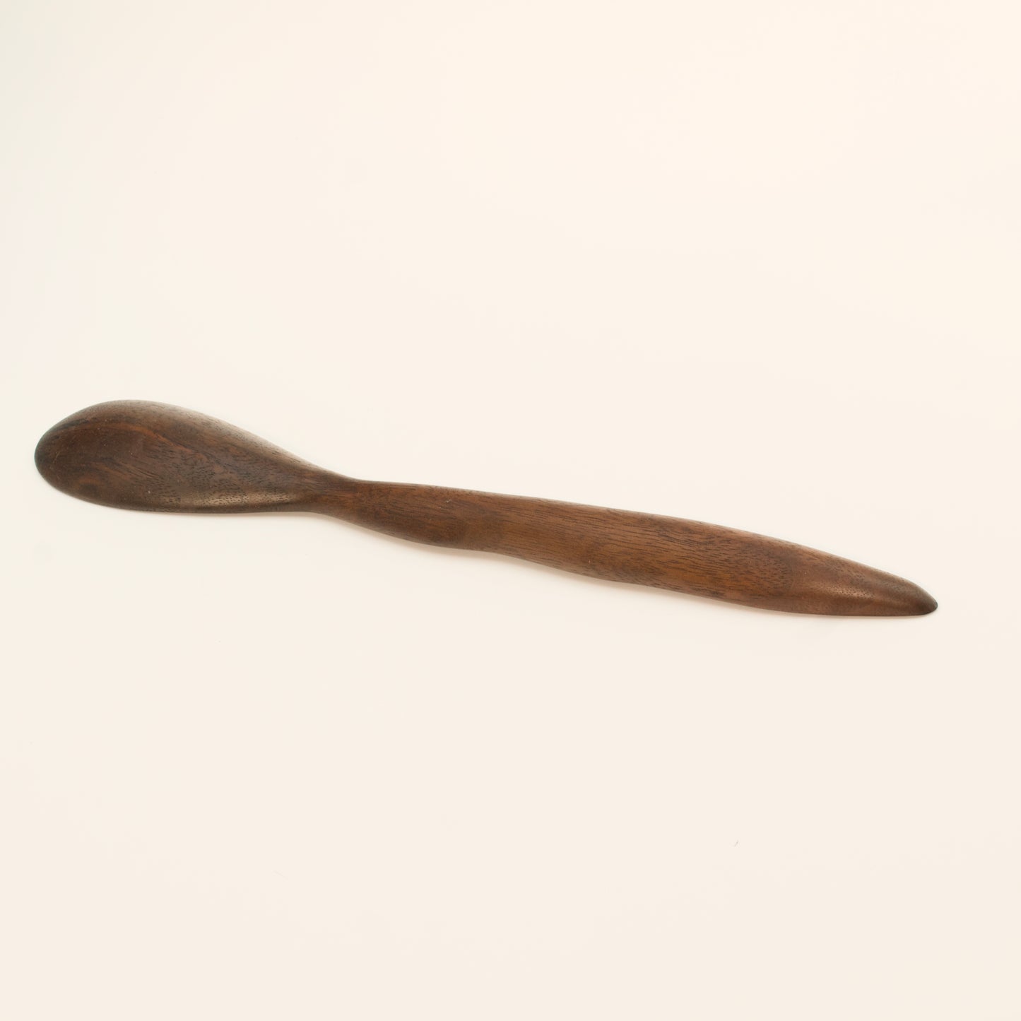Wooden spoon on a white background