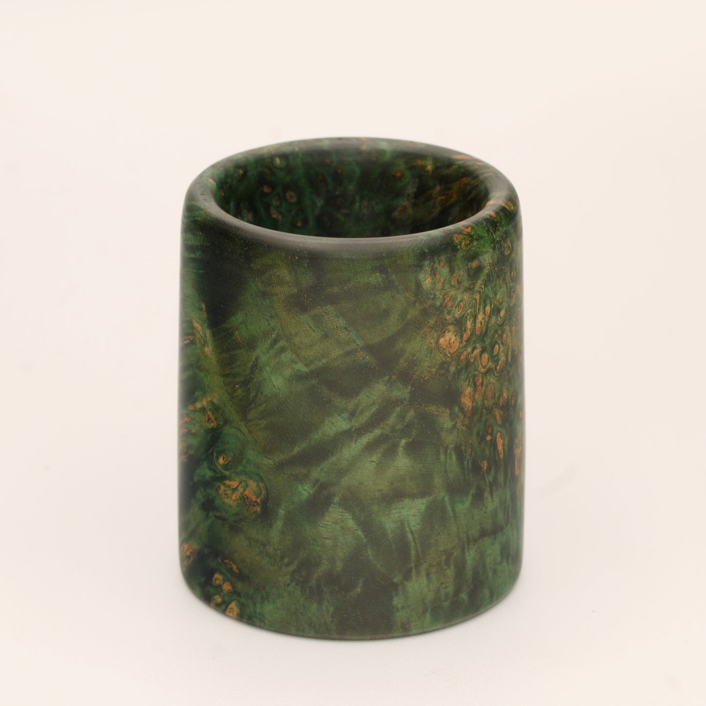 Green river tamarind burl wood shot glass against white background