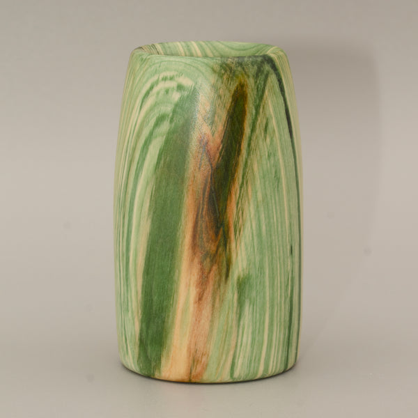 Aspen wood shot glass against grey background