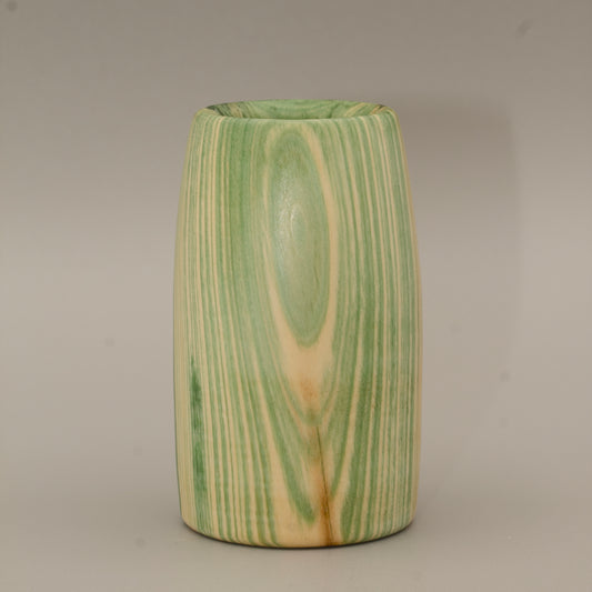 Aspen wood shot glass against grey background