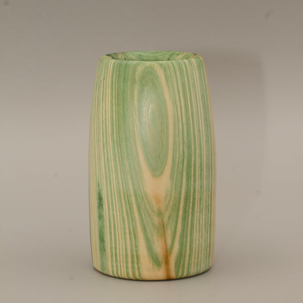 Aspen wood shot glass against grey background