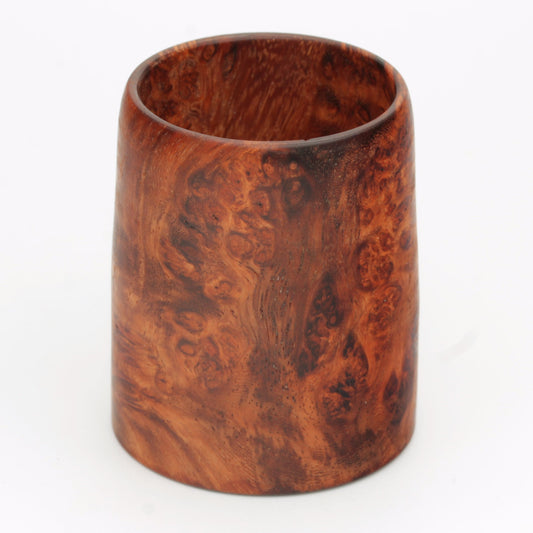 hand made wooden glass with rich reddish‑brown tones accented by lighter golden swirls