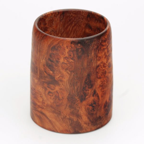 hand made wooden glass with rich reddish‑brown tones accented by lighter golden swirls