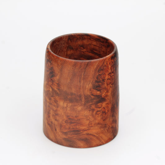 hand made wooden glass with rich reddish‑brown tones accented by lighter golden swirls