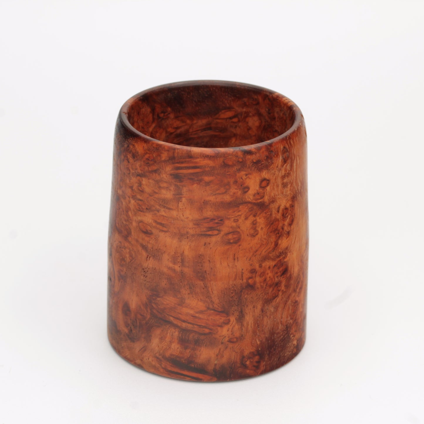hand made wooden glass with rich reddish‑brown tones accented by lighter golden swirls