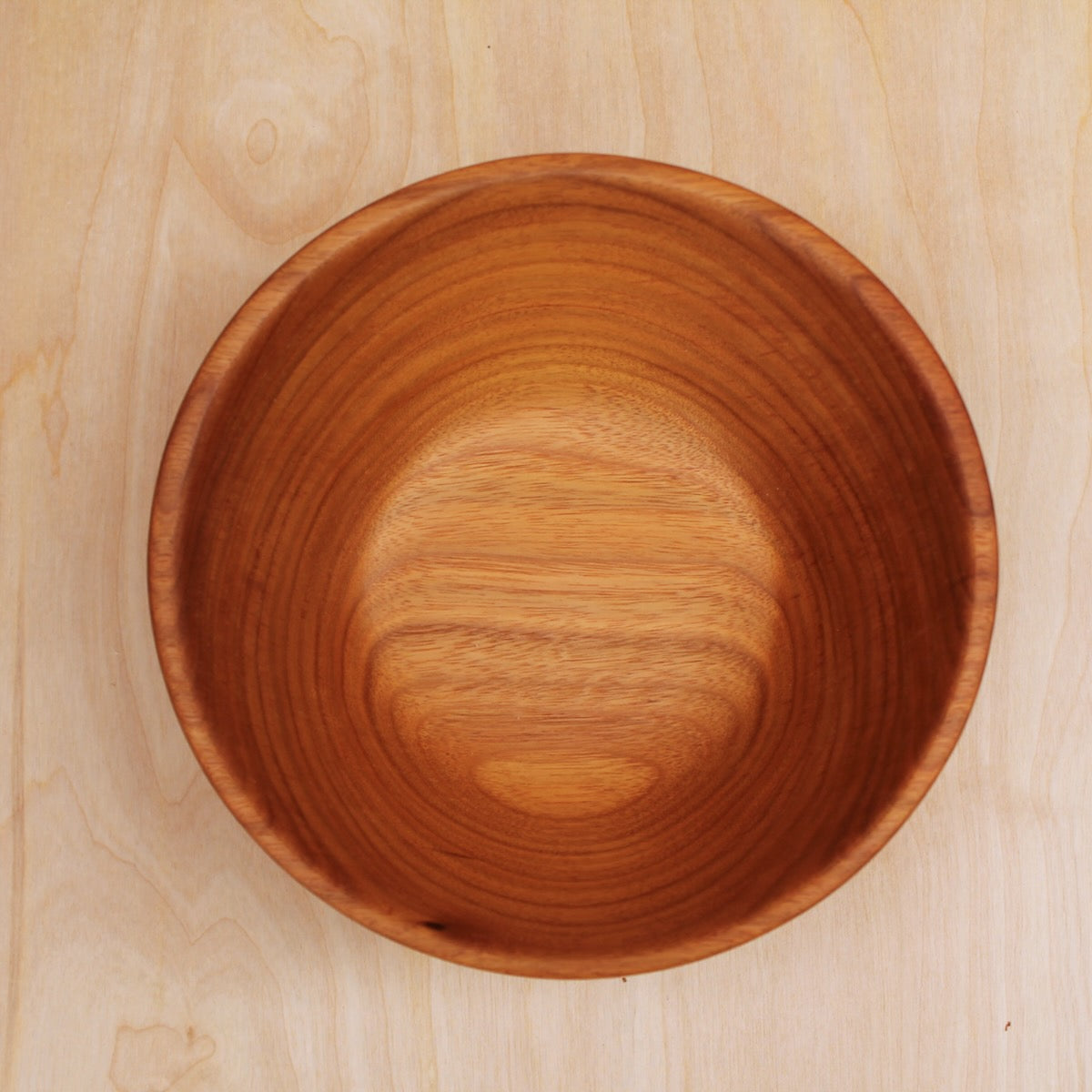 inside of a  hand made wooden salad bowl. shows beautiful tree ring 