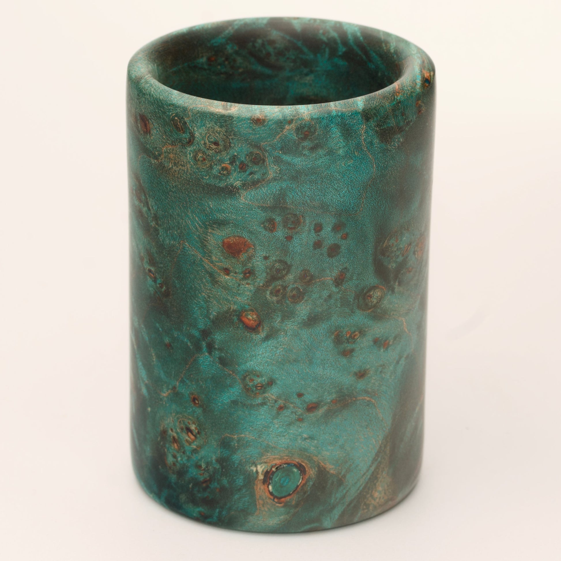 Green Dyed Mappa Burl shot glass against white background