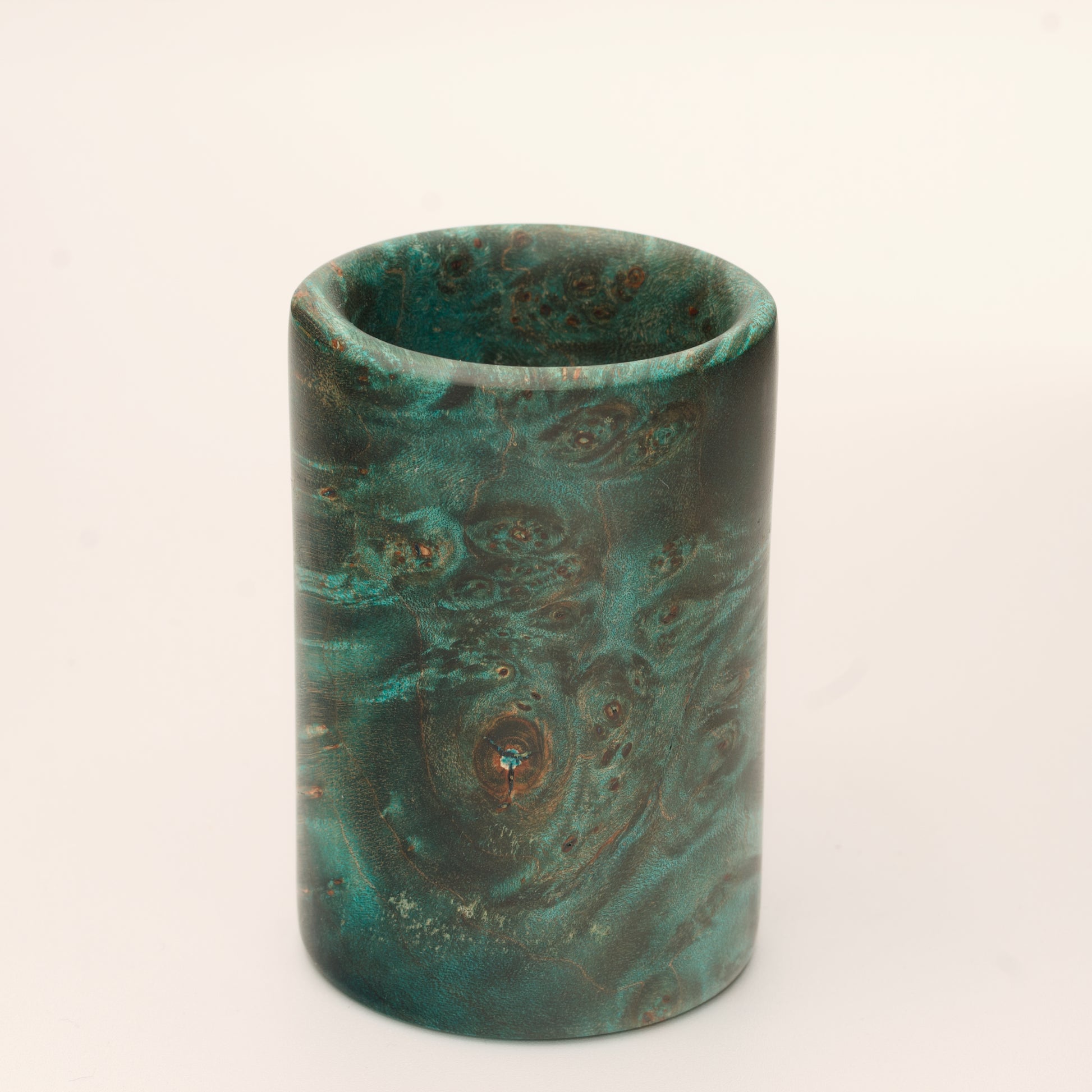 Green Dyed Mappa Burl shot glass against white background