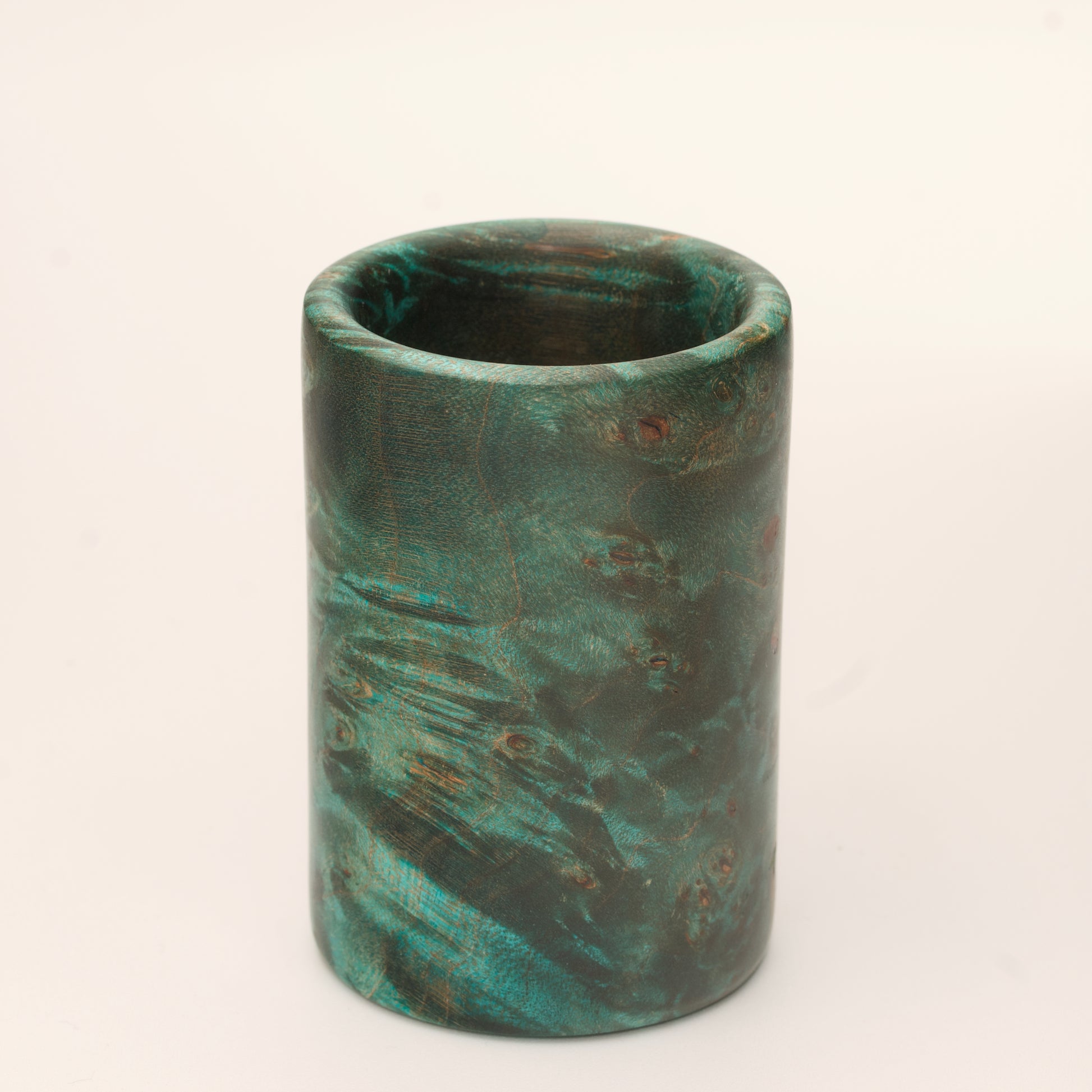 Green Dyed Mappa Burl shot glass against white background