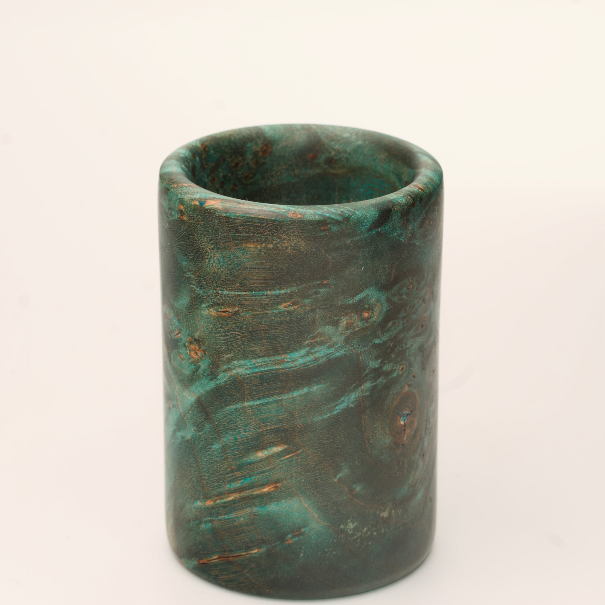 Green Dyed Mappa Burl shot glass against white background