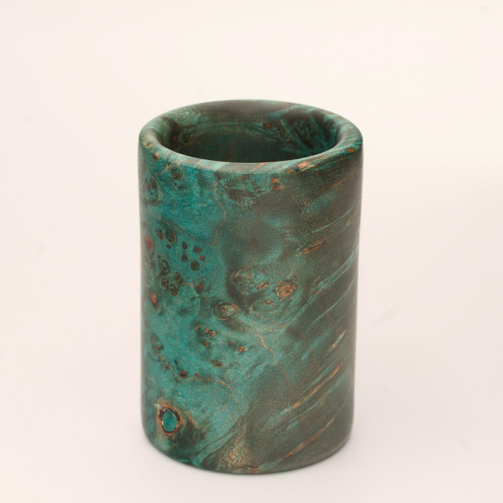 Green Dyed Mappa Burl shot glass against white background