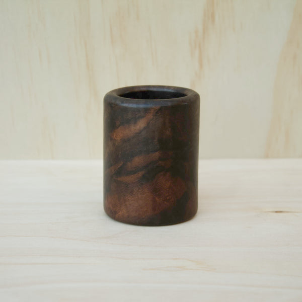 dark wooden cup with bold, intricate grain lines and deep tones