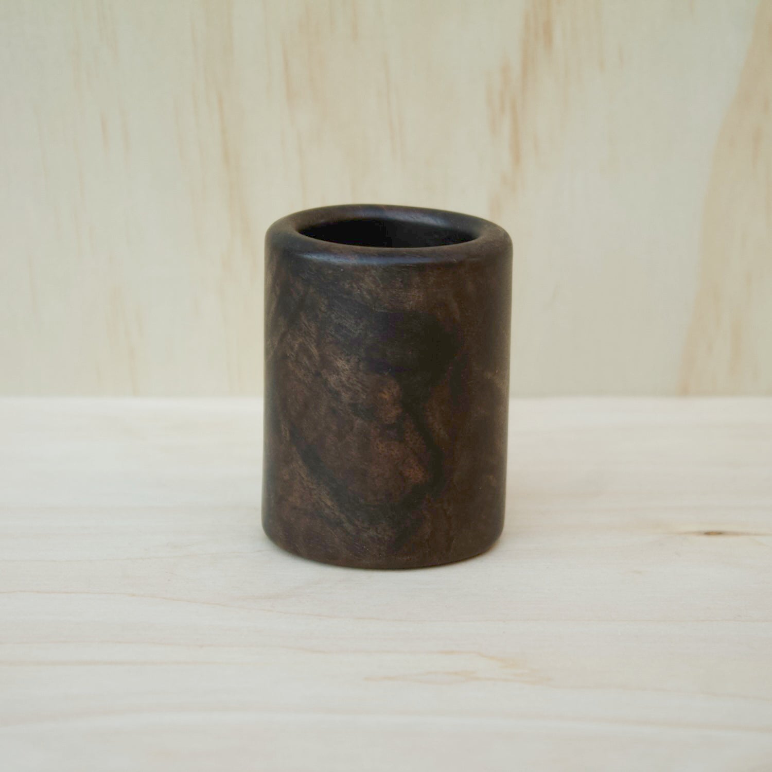 dark, hand made wooden shot glass