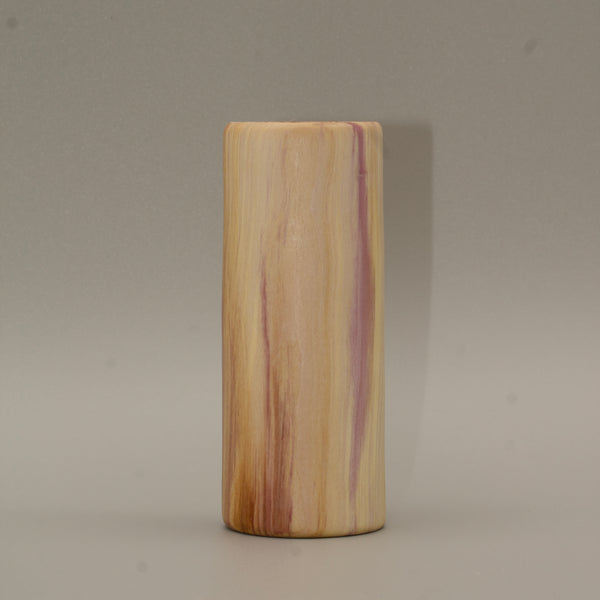 Tall rainbow colored aspen wood shot glass on white background