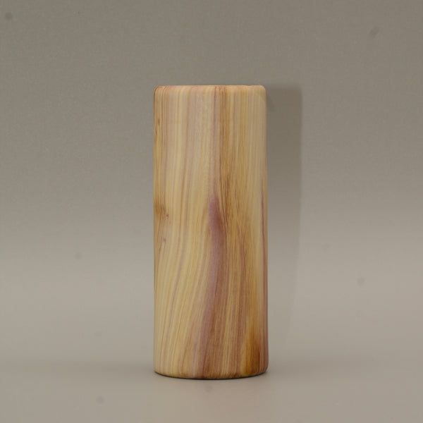 Tall rainbow colored aspen wood shot glass on white background