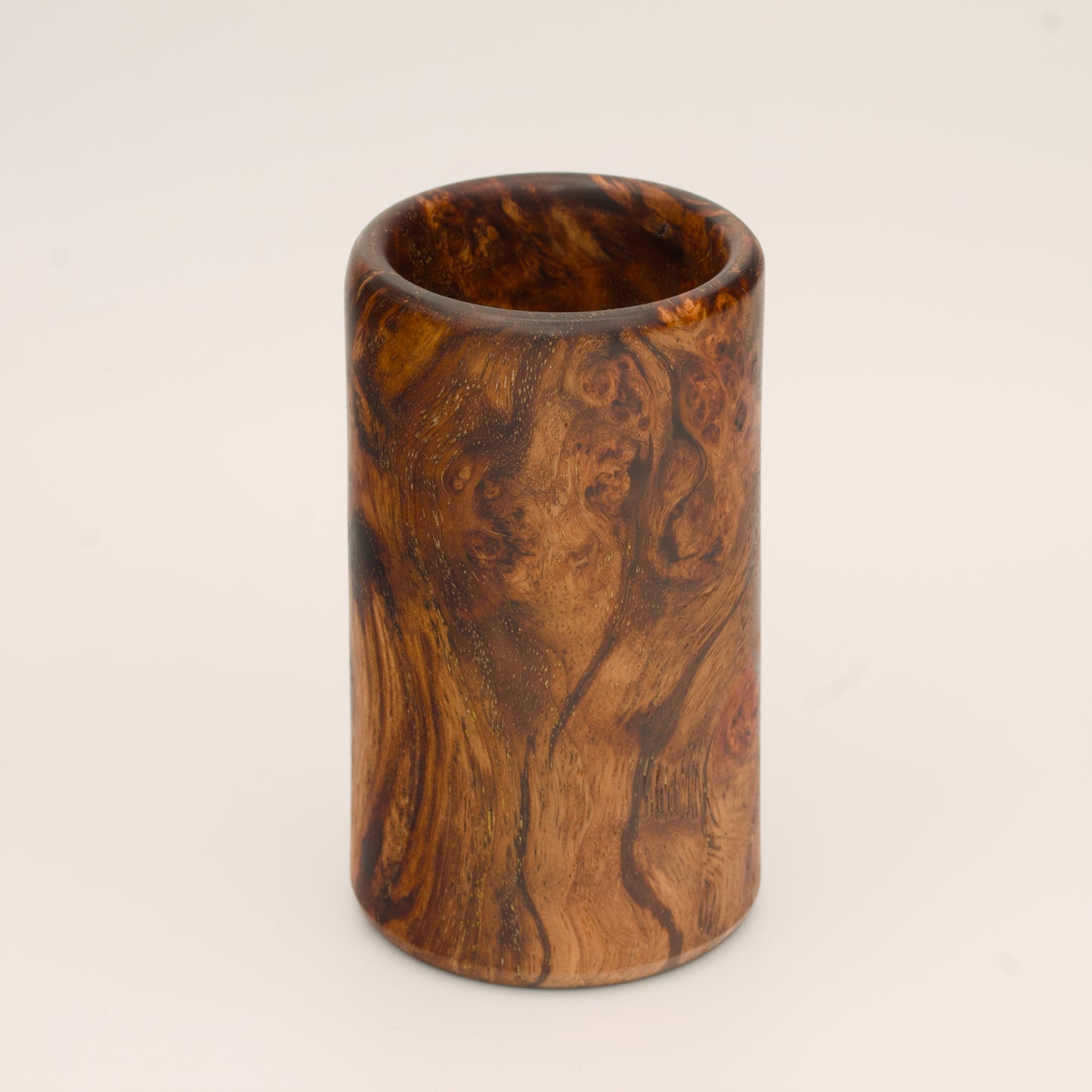 Big Leaf Maple Burl wood shot glass against white background
