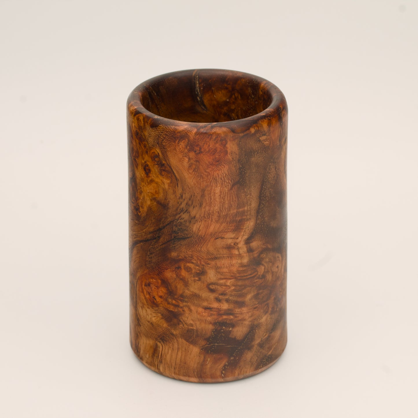 Big Leaf Maple Burl wood shot glass against white background