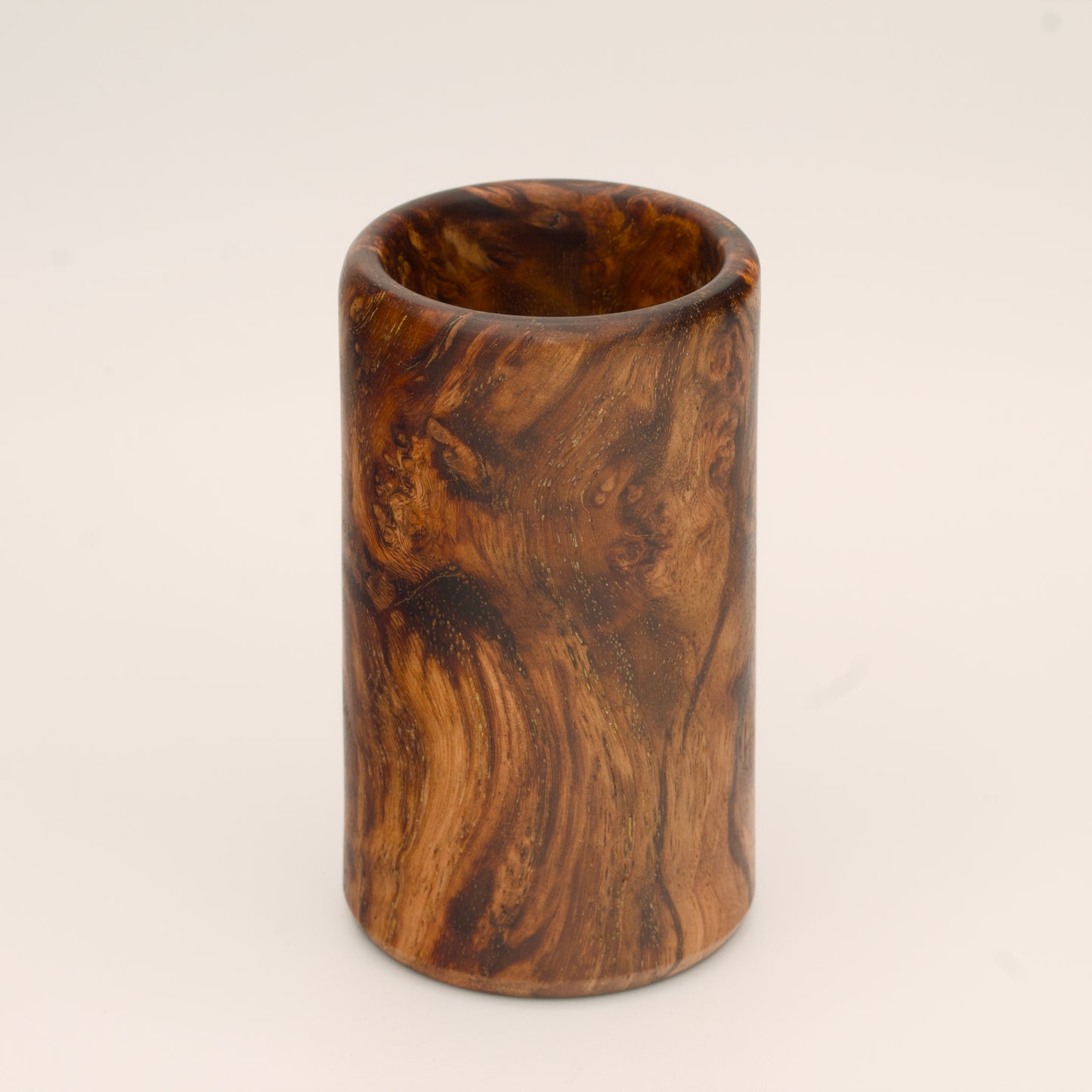 Big Leaf Maple Burl wood shot glass against white background