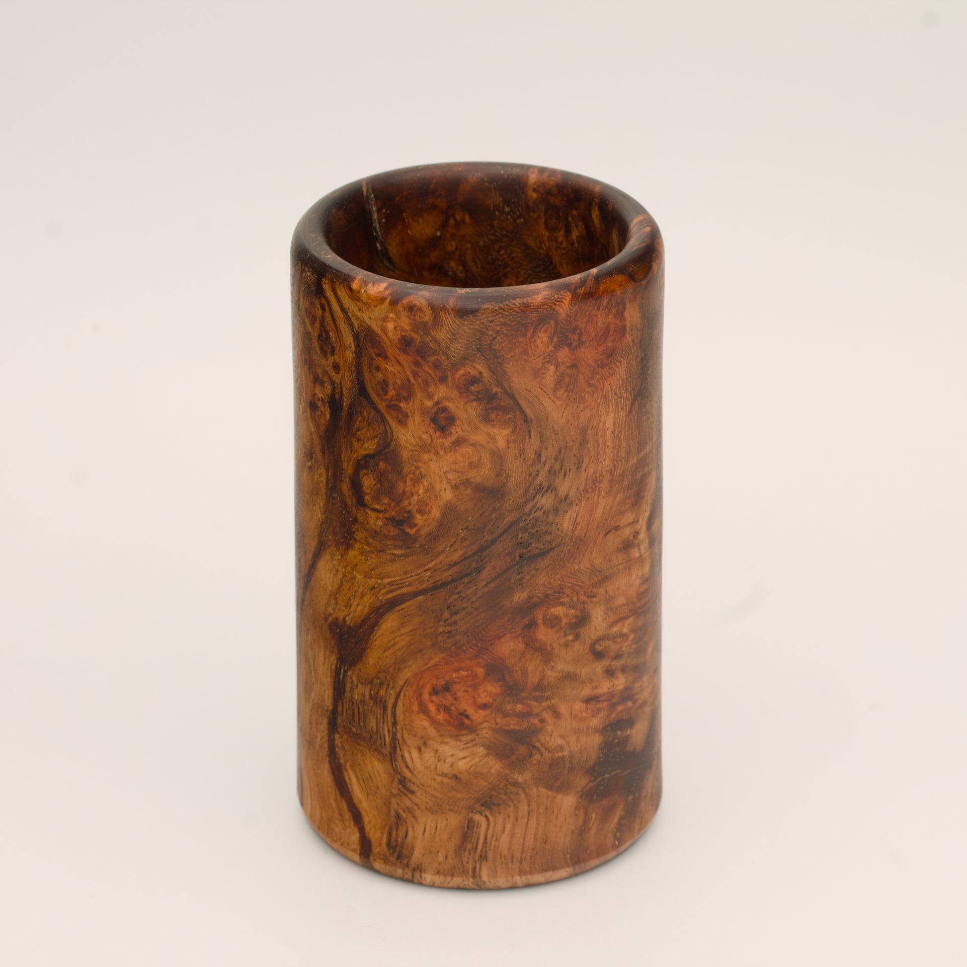 Big Leaf Maple Burl wood shot glass against white background