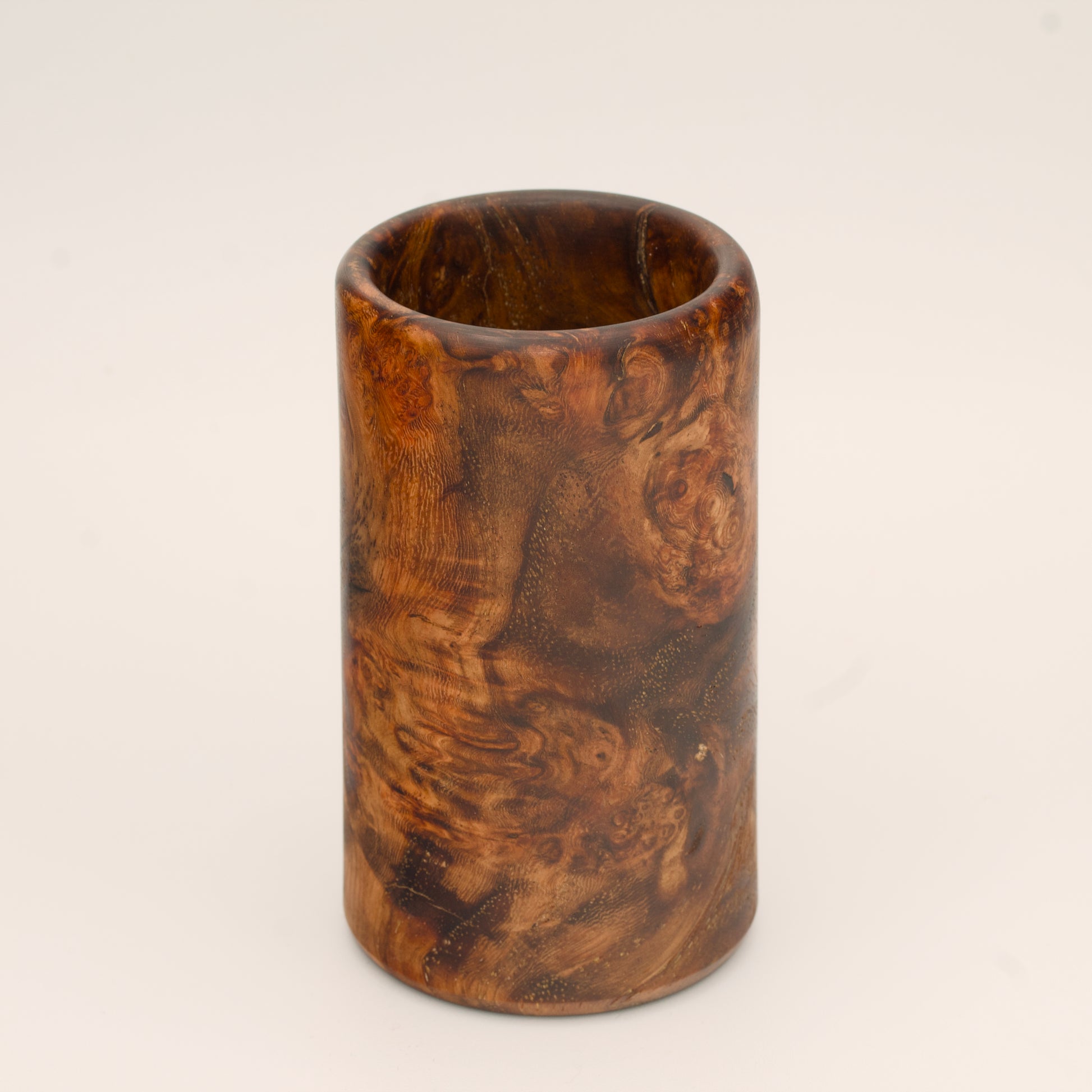 Big Leaf Maple Burl wood shot glass against white background