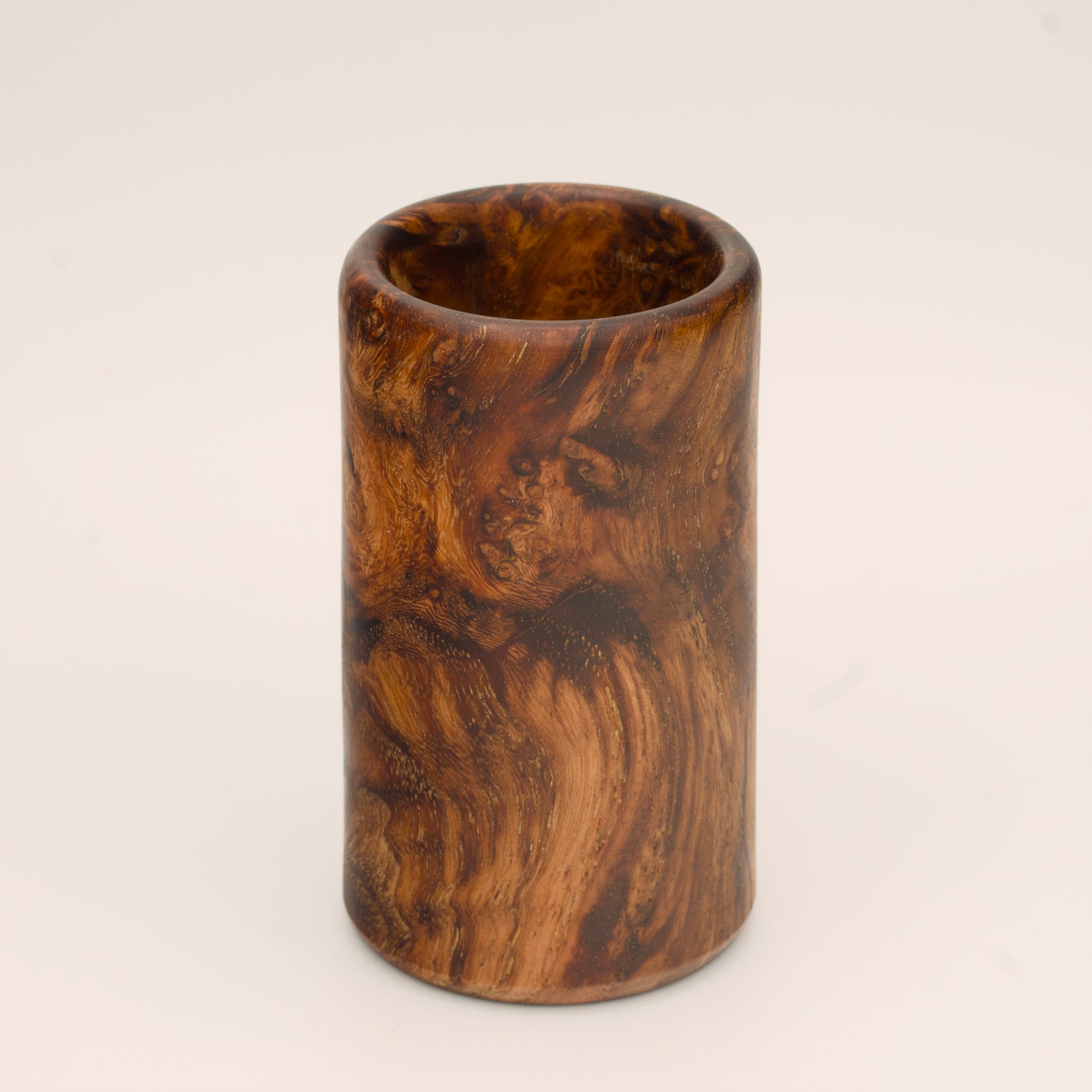 Big Leaf Maple Burl wood shot glass against white background
