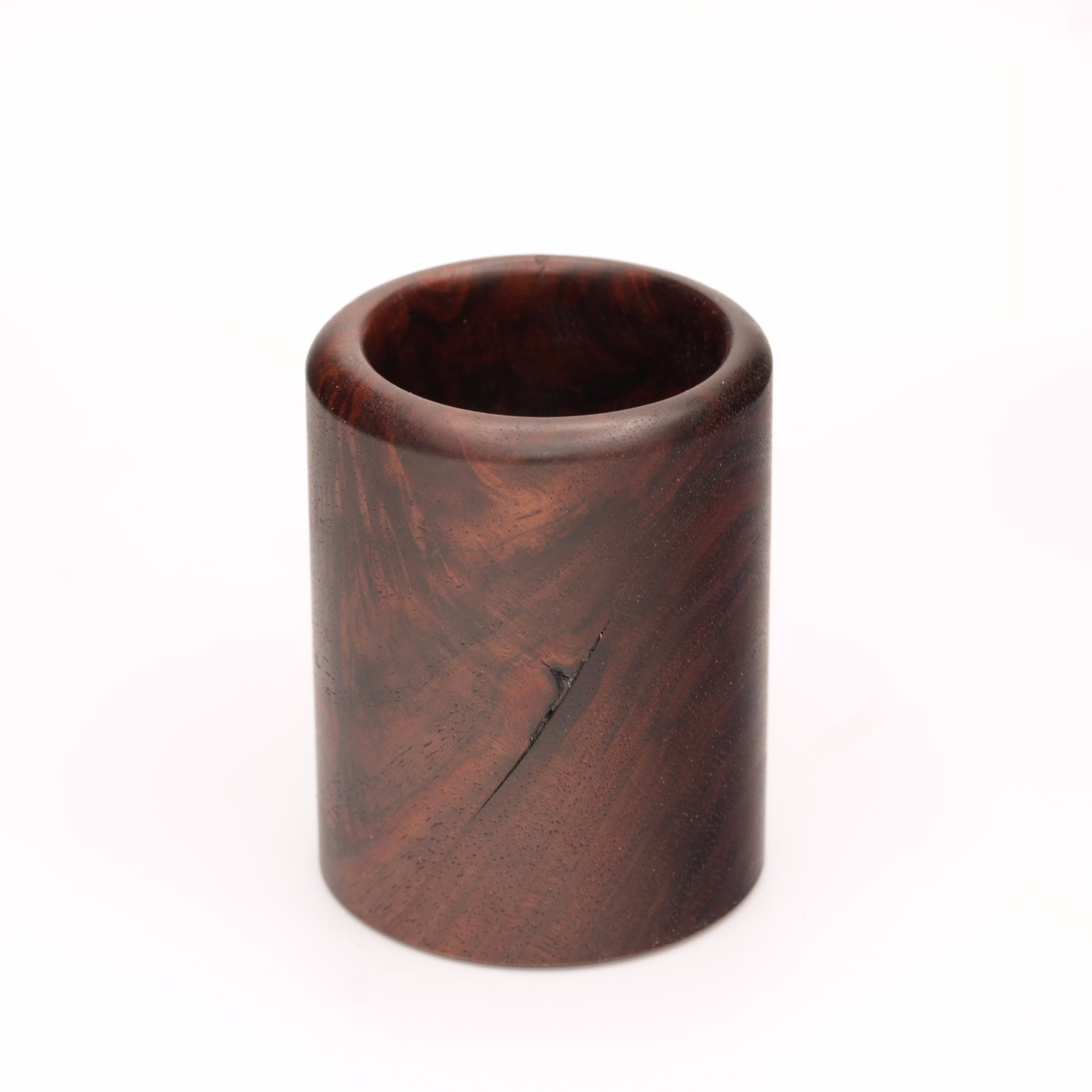 rich brown wooden with lighter streaks and subtle variations in grain shot glass on a white background. 