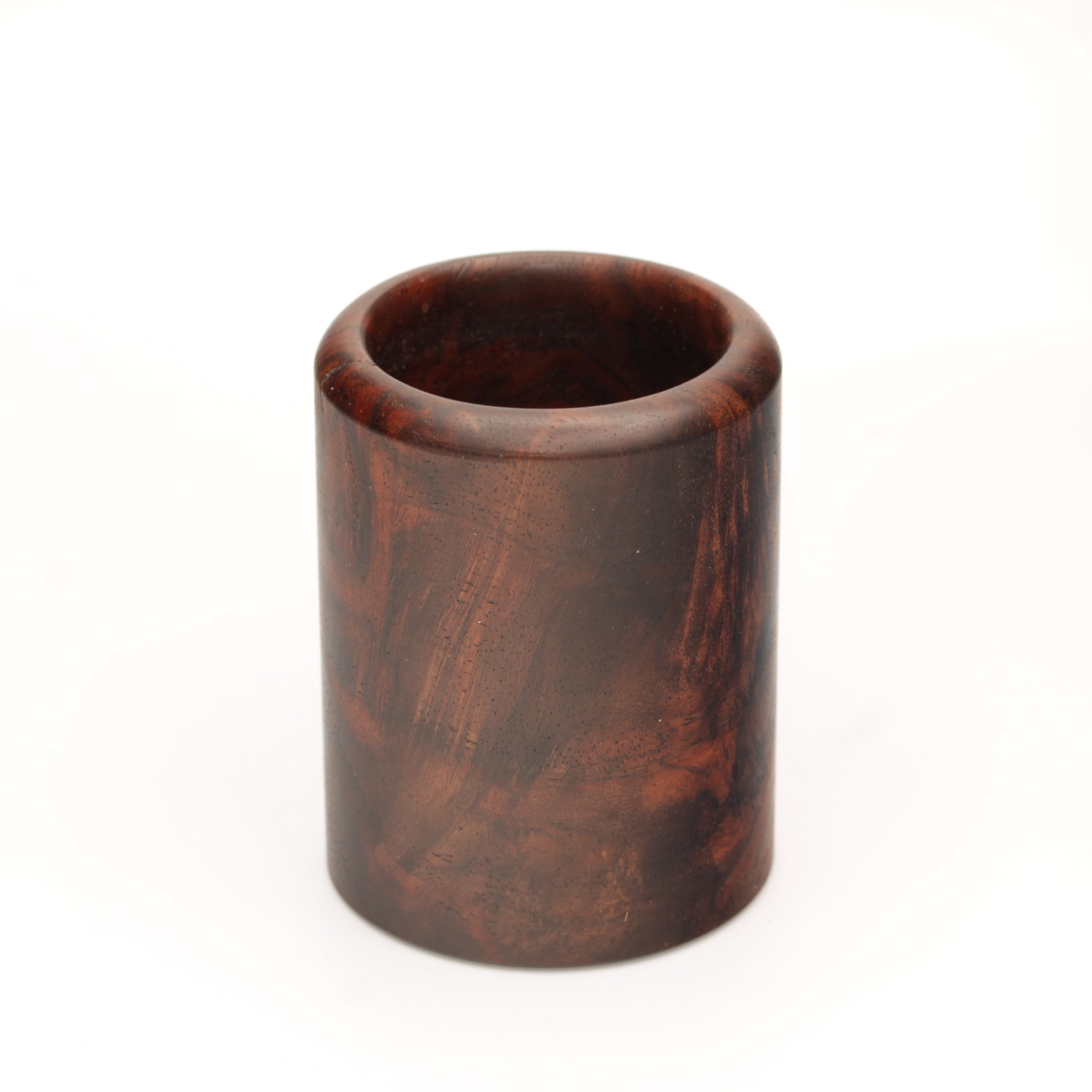 rich brown wooden with lighter streaks and subtle variations in grain shot glass on a white background. 