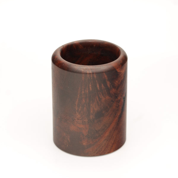 rich brown wooden with lighter streaks and subtle variations in grain shot glass on a white background. 