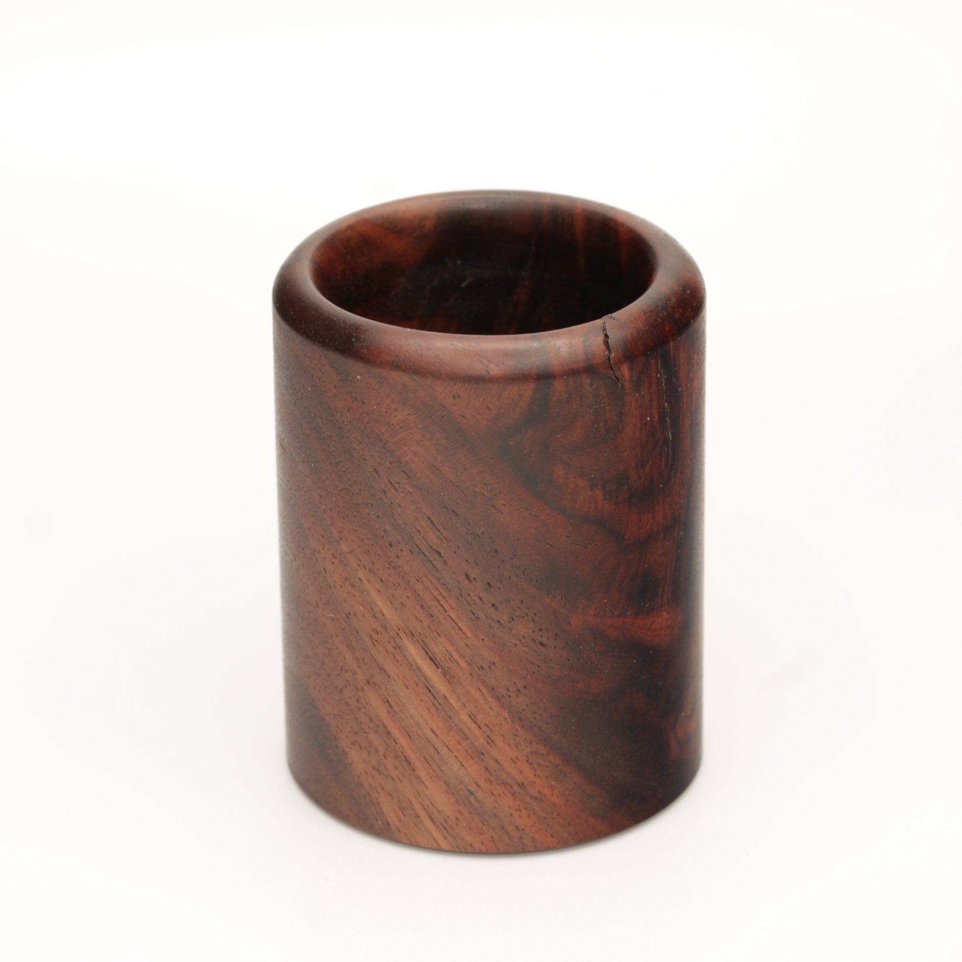 rich brown wooden with lighter streaks and subtle variations in grain shot glass on a white background. 