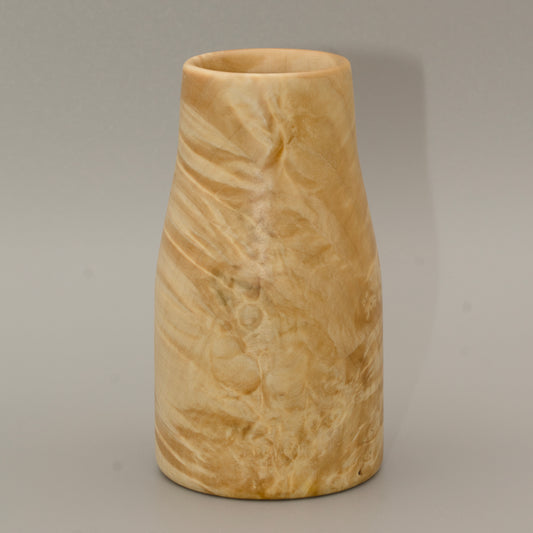 Giant box elder burl wood shot glass against white background