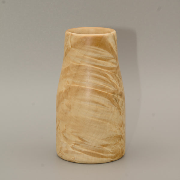 Giant box elder burl wood shot glass against white background