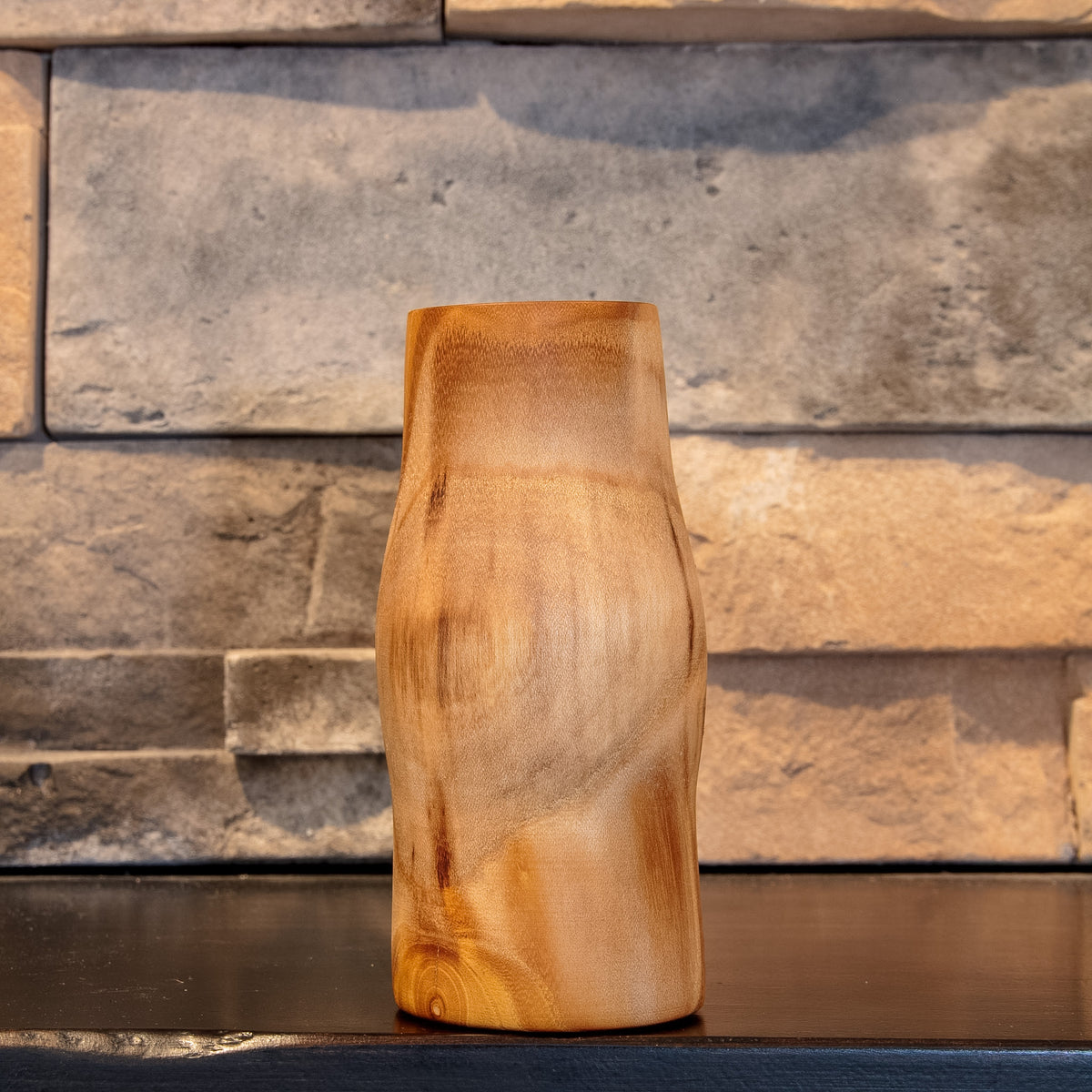 Eòlas White Mulberry shot glass with broad smoky-brown grain sweeping around the curved exterior