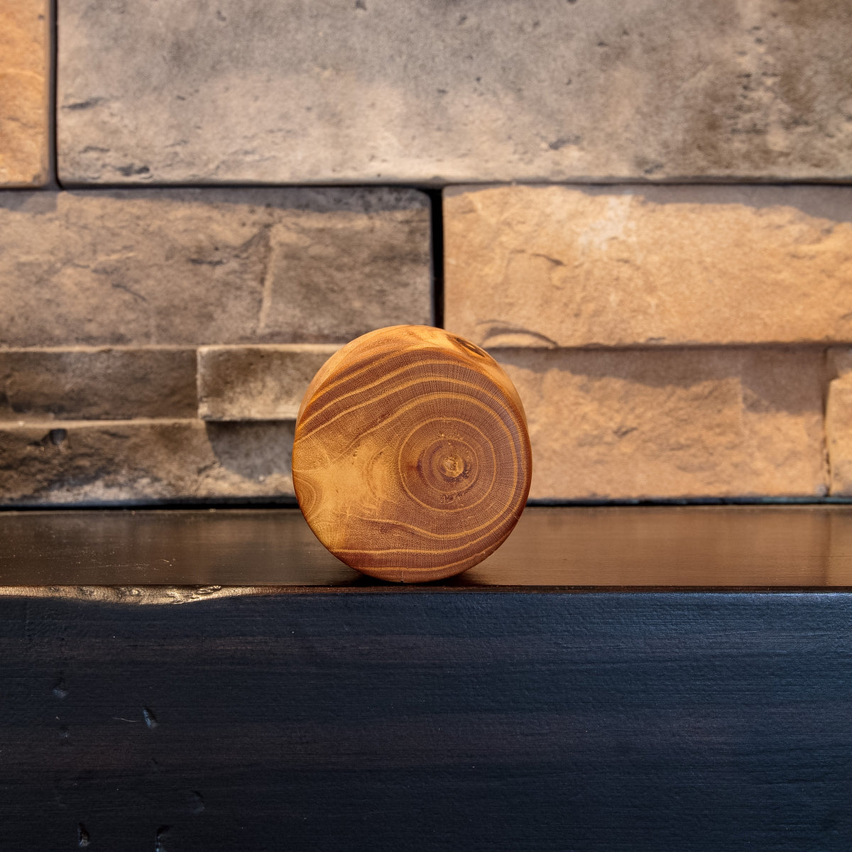 Bottom view of Eòlas showing concentric brown-and-gold end grain