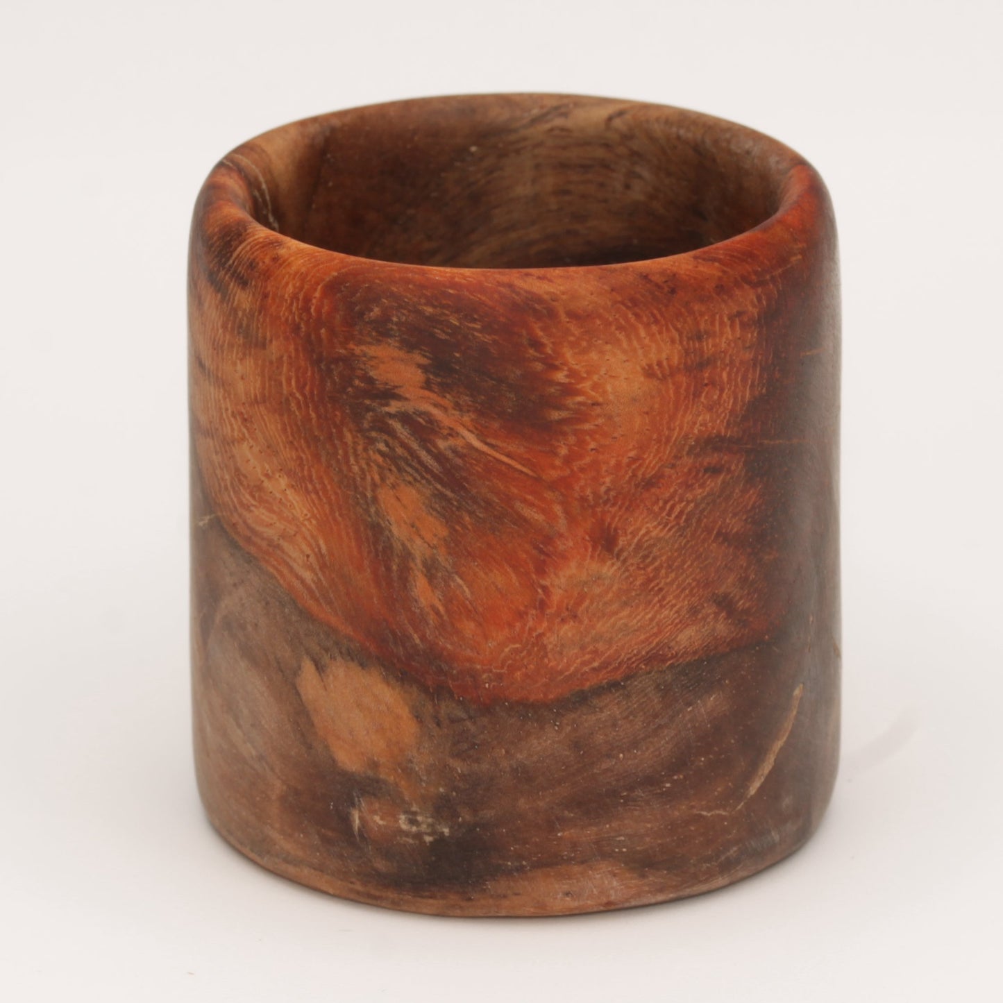 Amboyna burl shot glass against white background