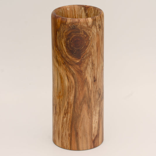Plains cottonwood wood shot glass against white background