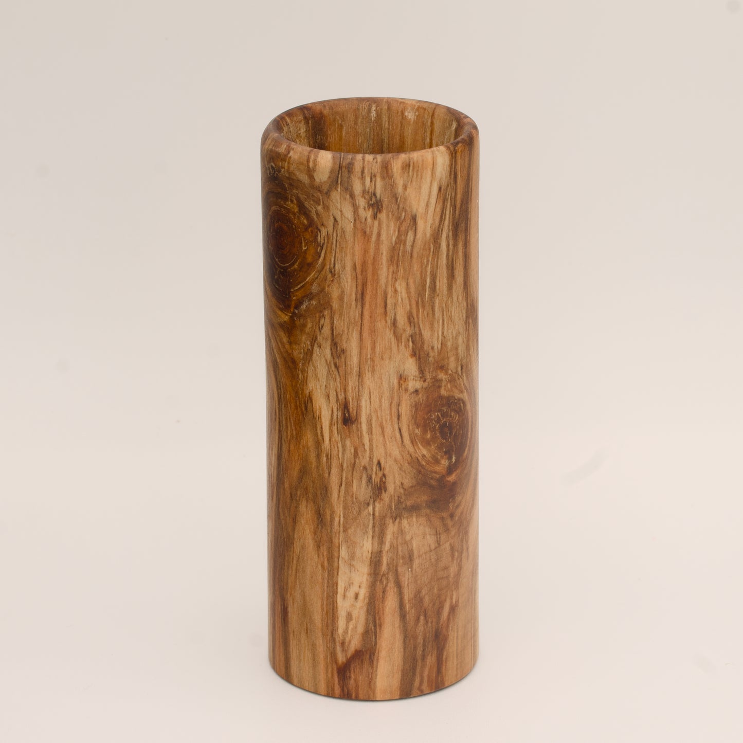 Plains cottonwood wood shot glass against white background
