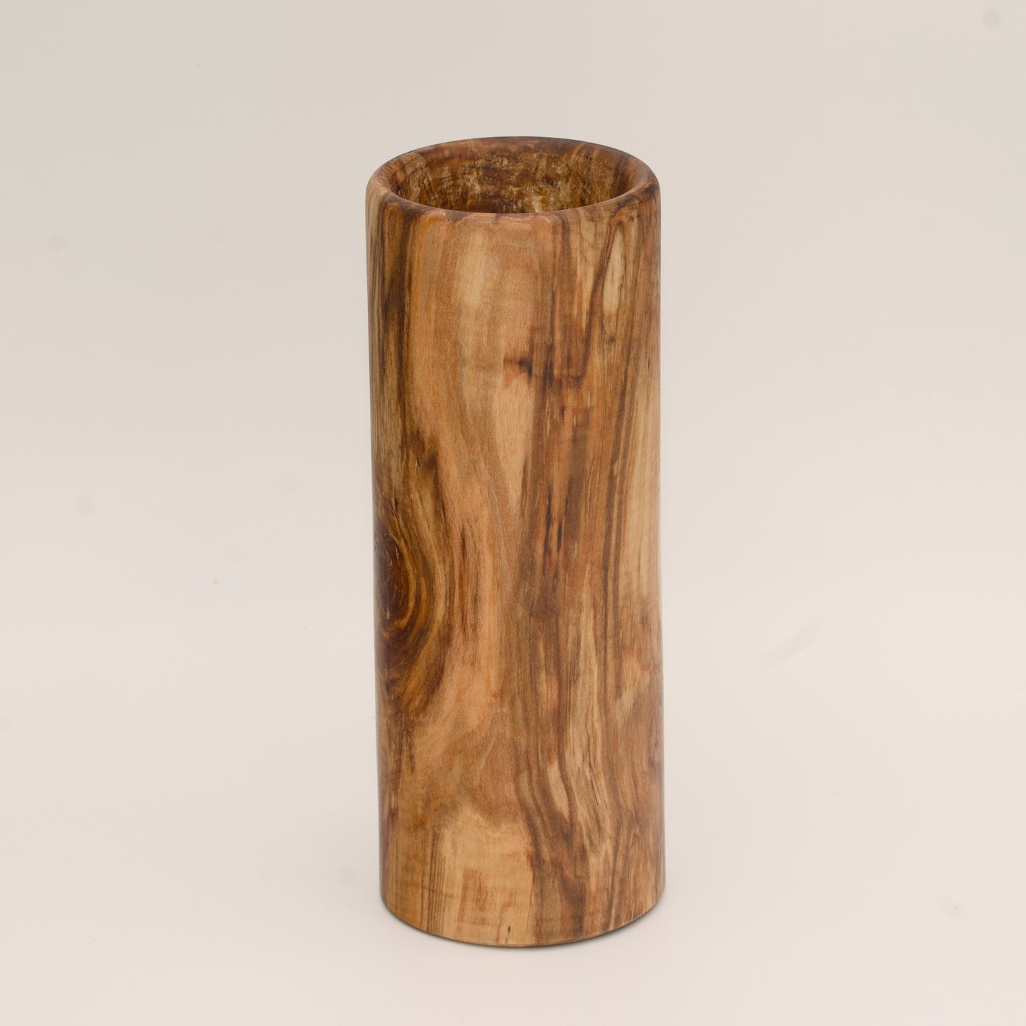 Plains cottonwood wood shot glass against white background