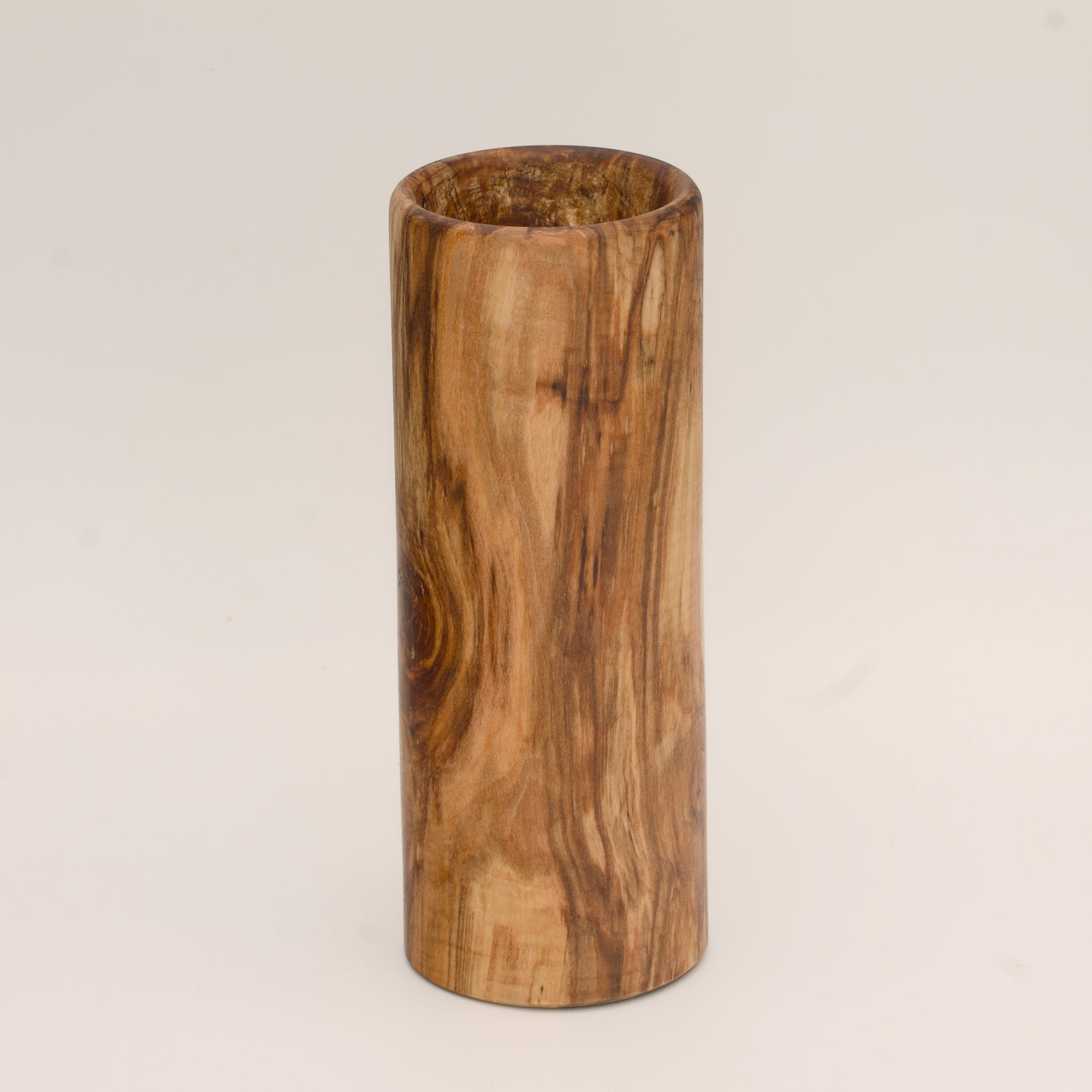 Plains cottonwood wood shot glass against white background