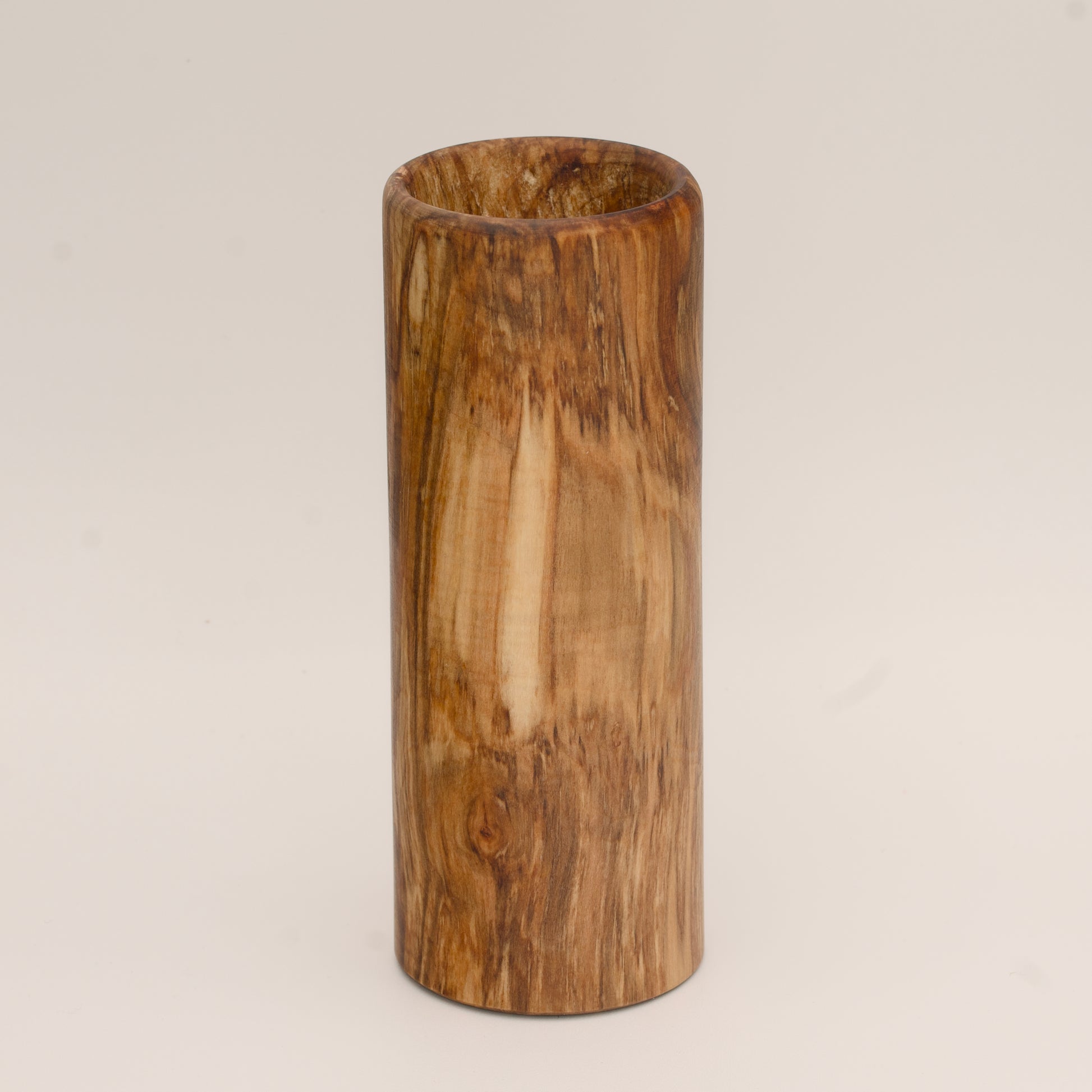 Plains cottonwood wood shot glass against white background