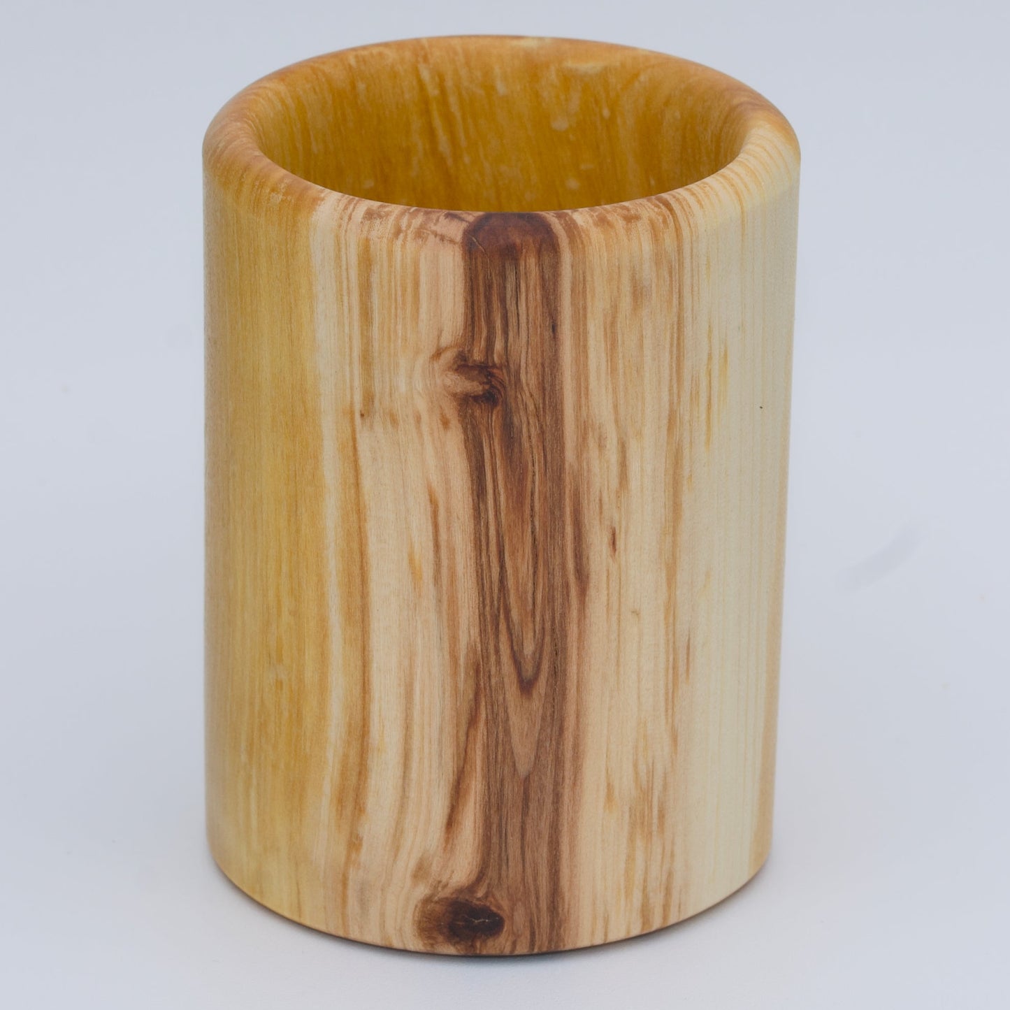 Aspen wood shot glass against white background