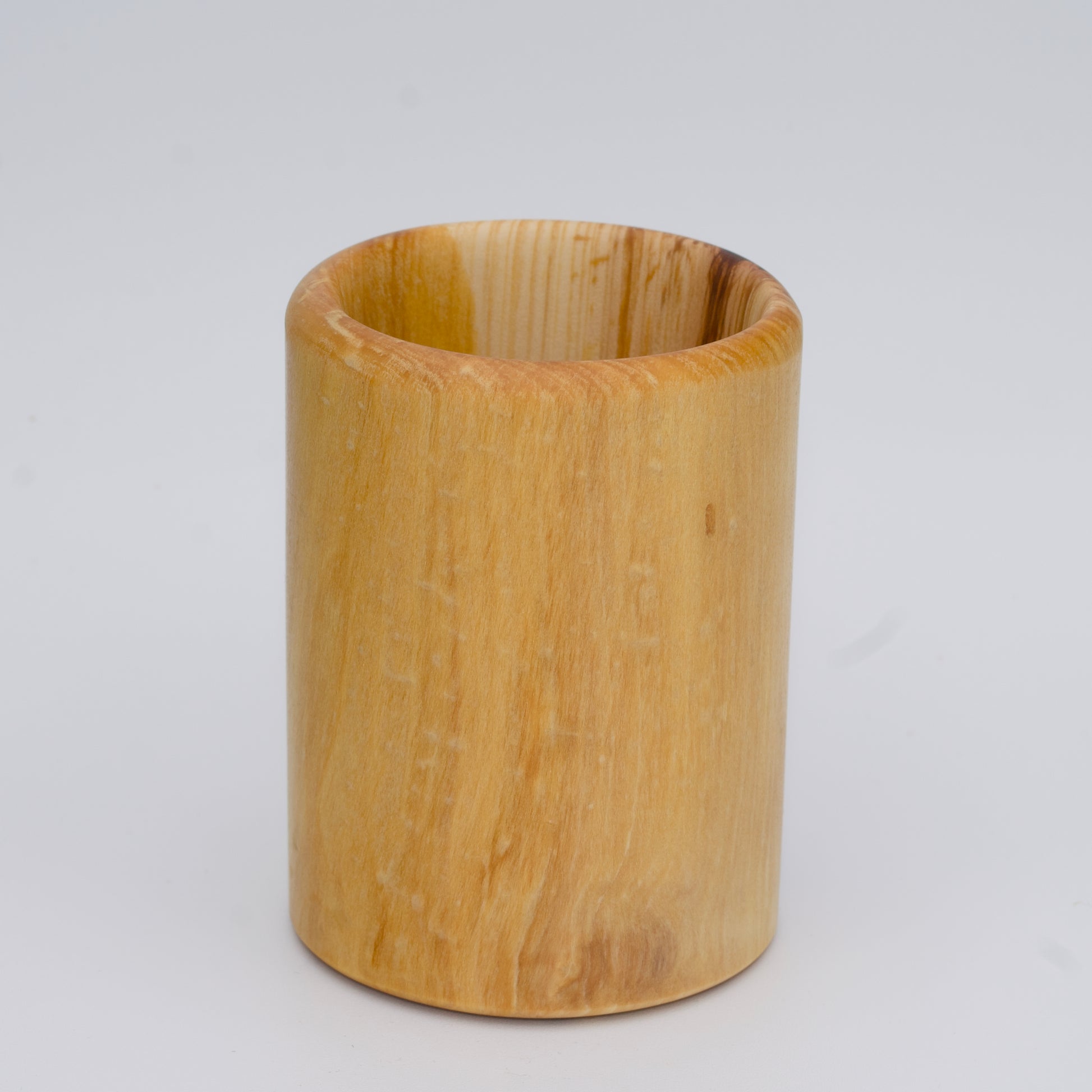Aspen wood shot glass against white background